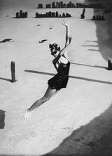 Pamela Minchin photographed on the Isle of Wight wearing Fortnum and Mason's dark burgundy Lastex satin swimsuit with ballet skirt, July 1939